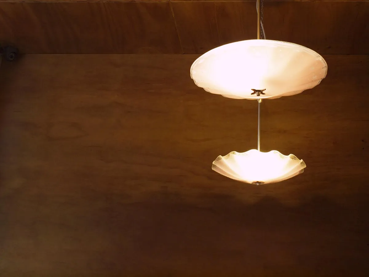Krimper Cafe interior with exposed brick walls and warm ambient lighting