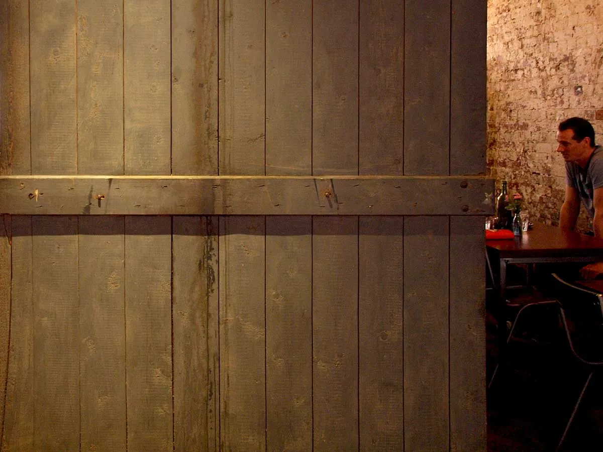 Krimper Cafe atmosphere — aged wooden walls and industrial heritage